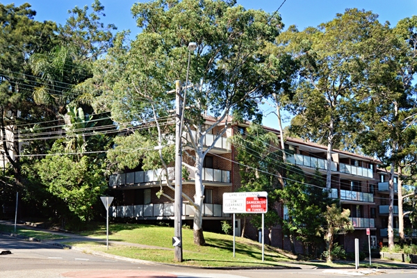 Photo of four storey apartment building with new balconies and balustrades at Artarmon